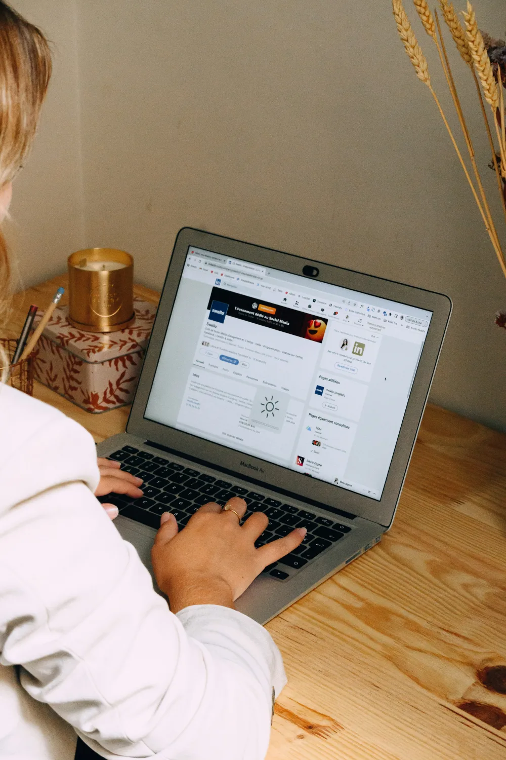 An educator working on a course from a laptop