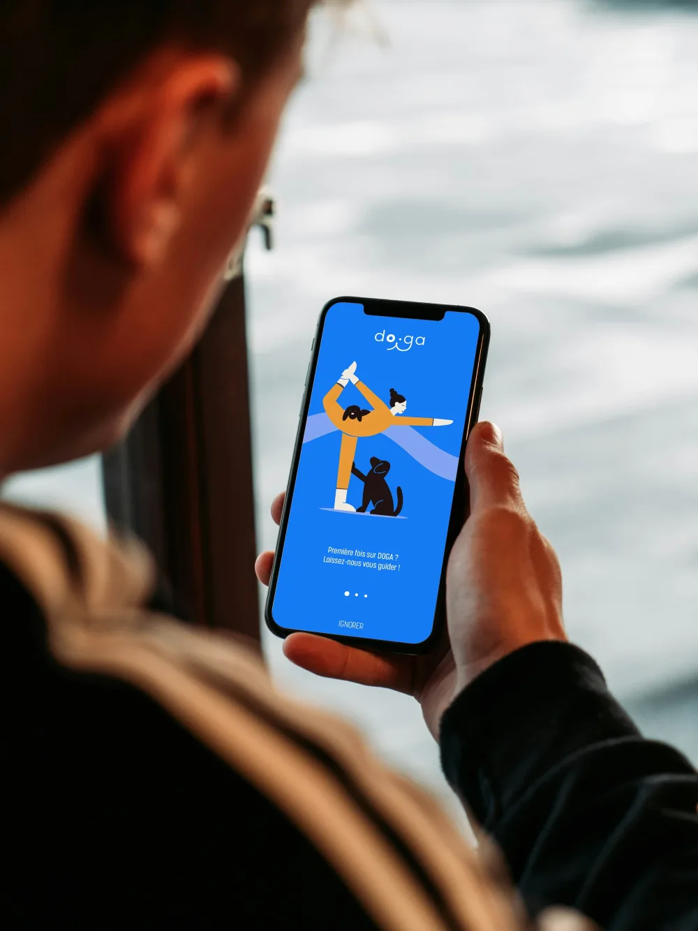 A person using a guided wellbeing app on their phone